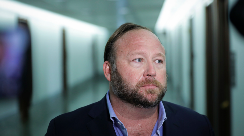 WASHINGTON, DC - SEPTEMBER 5: Alex Jones of InfoWars talks to reporters outside a Senate Intelligence Committee hearing concerning foreign influence operations’ use of social media platforms, on Capitol Hill, September 5, 2018 in Washington, DC. Twitter CEO Jack Dorsey and Facebook chief operating officer Sheryl Sandberg faced questions about how foreign operatives use their platforms in attempts to influence and manipulate public opinion.
